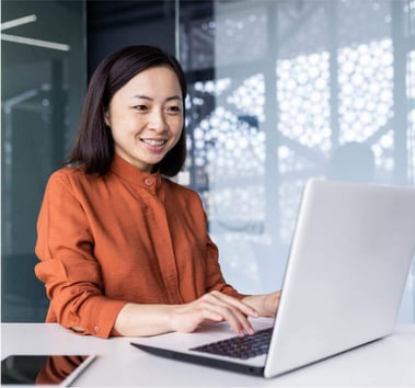 Legal assistant using immigration software on laptop